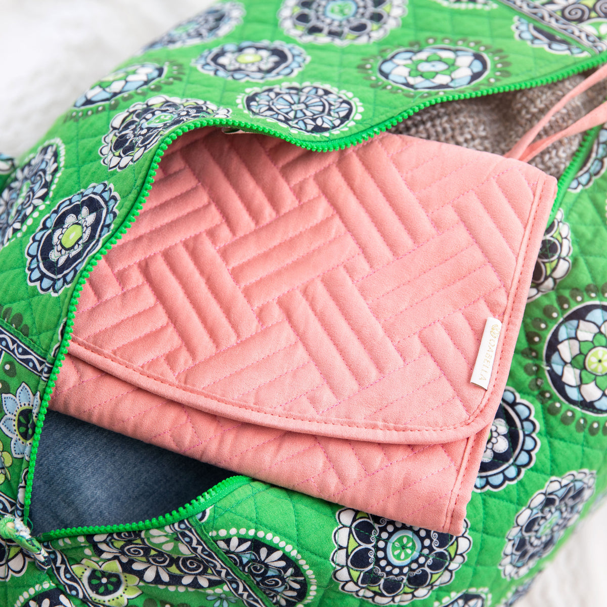 Folded pink Oabella organizer packed in a travel bag