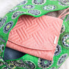 Folded pink Oabella organizer packed in a travel bag